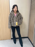 No. 314 Grey hooded mink fur coat with horizontal leather paneling.