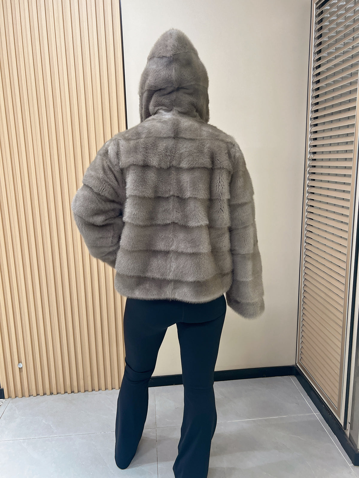 No. 314 Grey hooded mink fur coat with horizontal leather paneling.