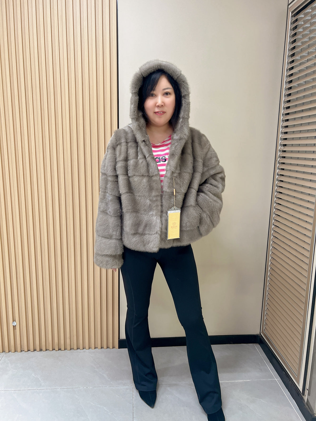 No. 314 Grey hooded mink fur coat with horizontal leather paneling.