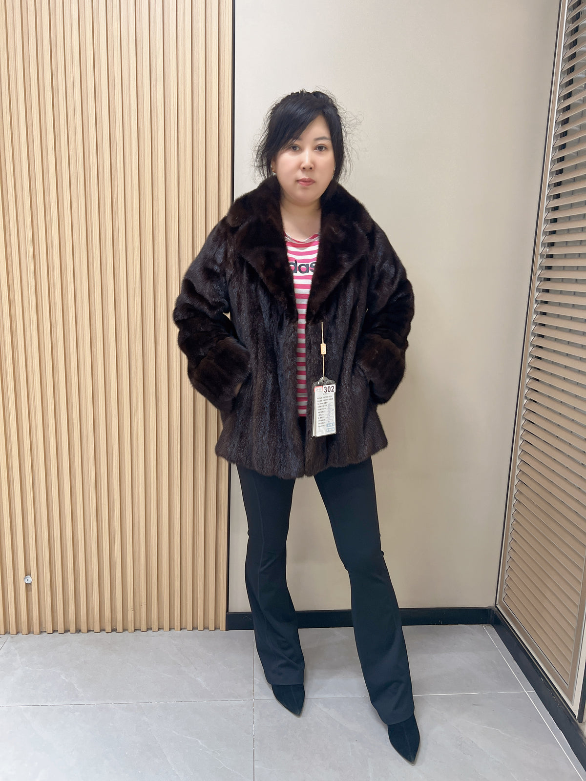 No. 302 dark brown mink fur coat, featuring a tailored collar and turn-up cuffs.