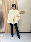 No. 338: Off-white mink fur coat featuring a stand collar and turn-back cuffs.