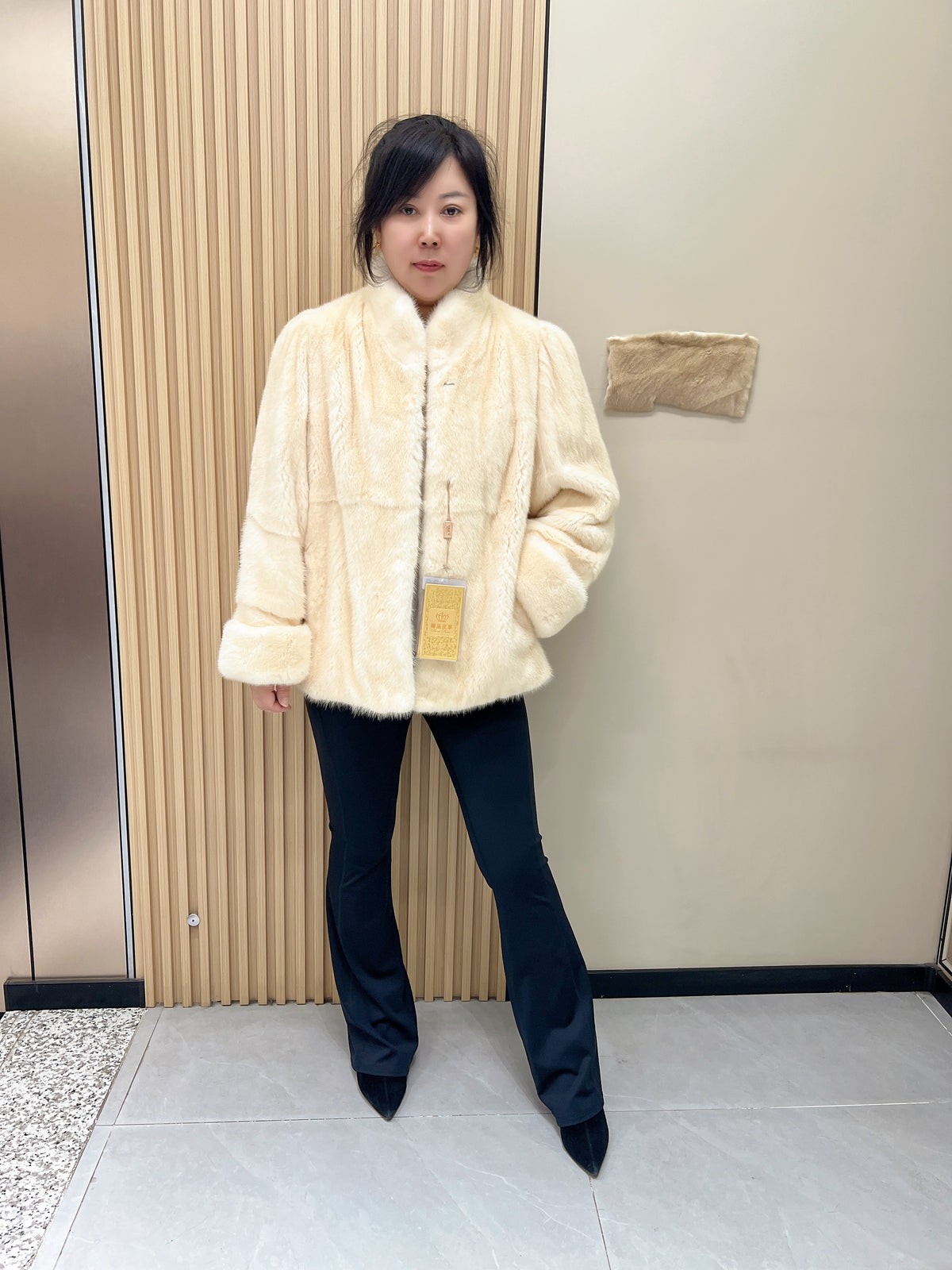 No. 338: Off-white mink fur coat featuring a stand collar and turn-back cuffs.