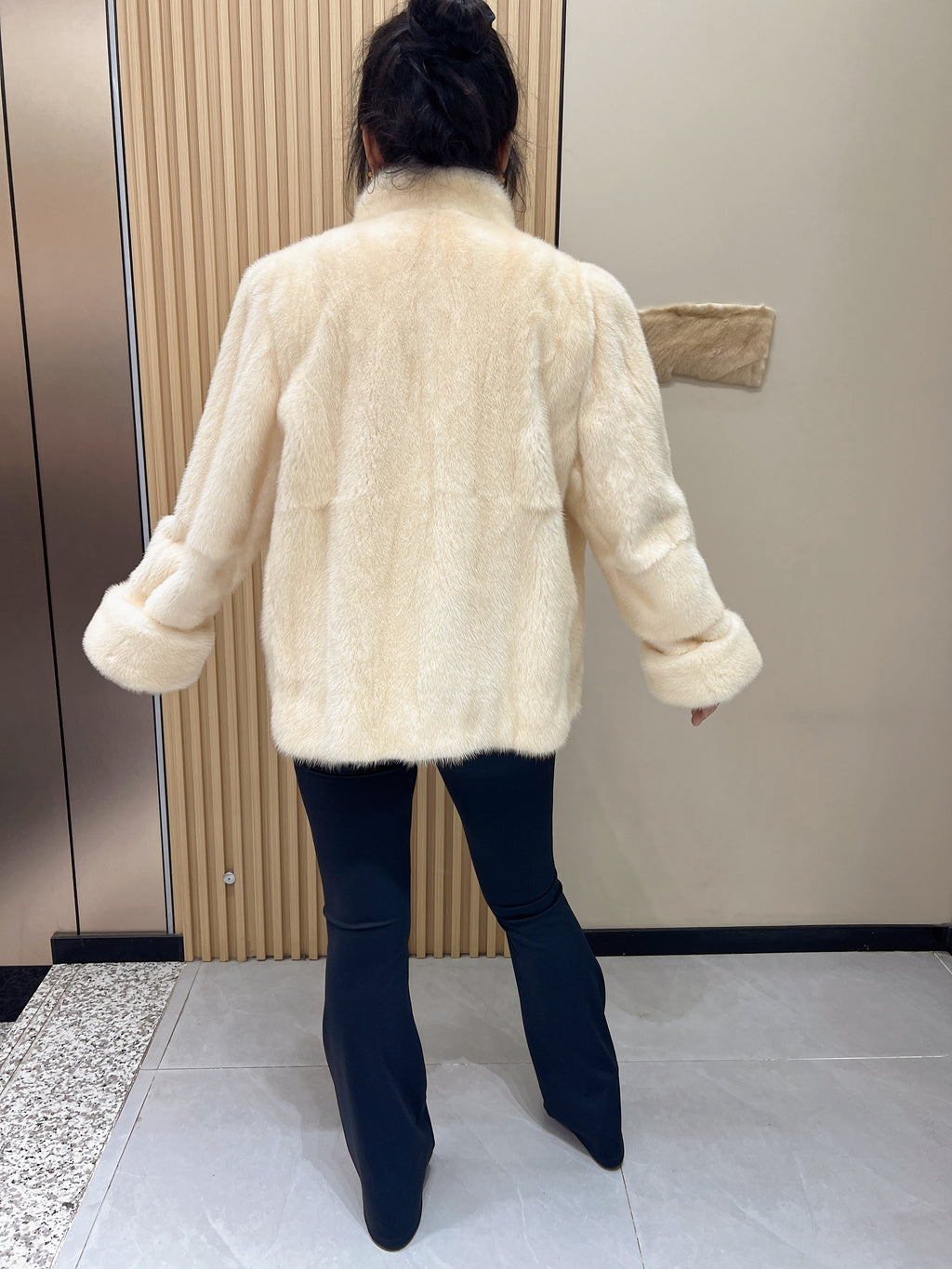 No. 338: Off-white mink fur coat featuring a stand collar and turn-back cuffs.