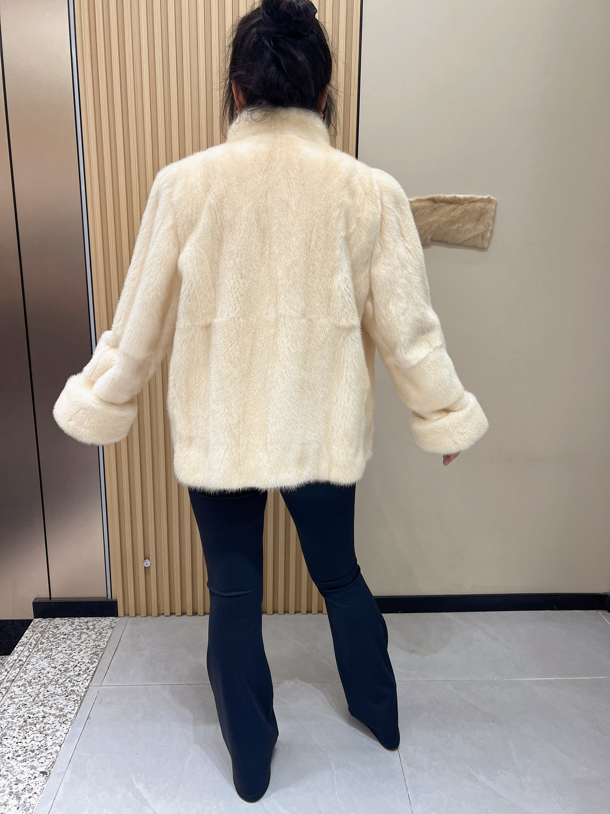 No. 338: Off-white mink fur coat featuring a stand collar and turn-back cuffs.