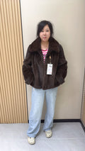 No. 002 Brown mink coat with a shawl collar and turn-up cuffs.