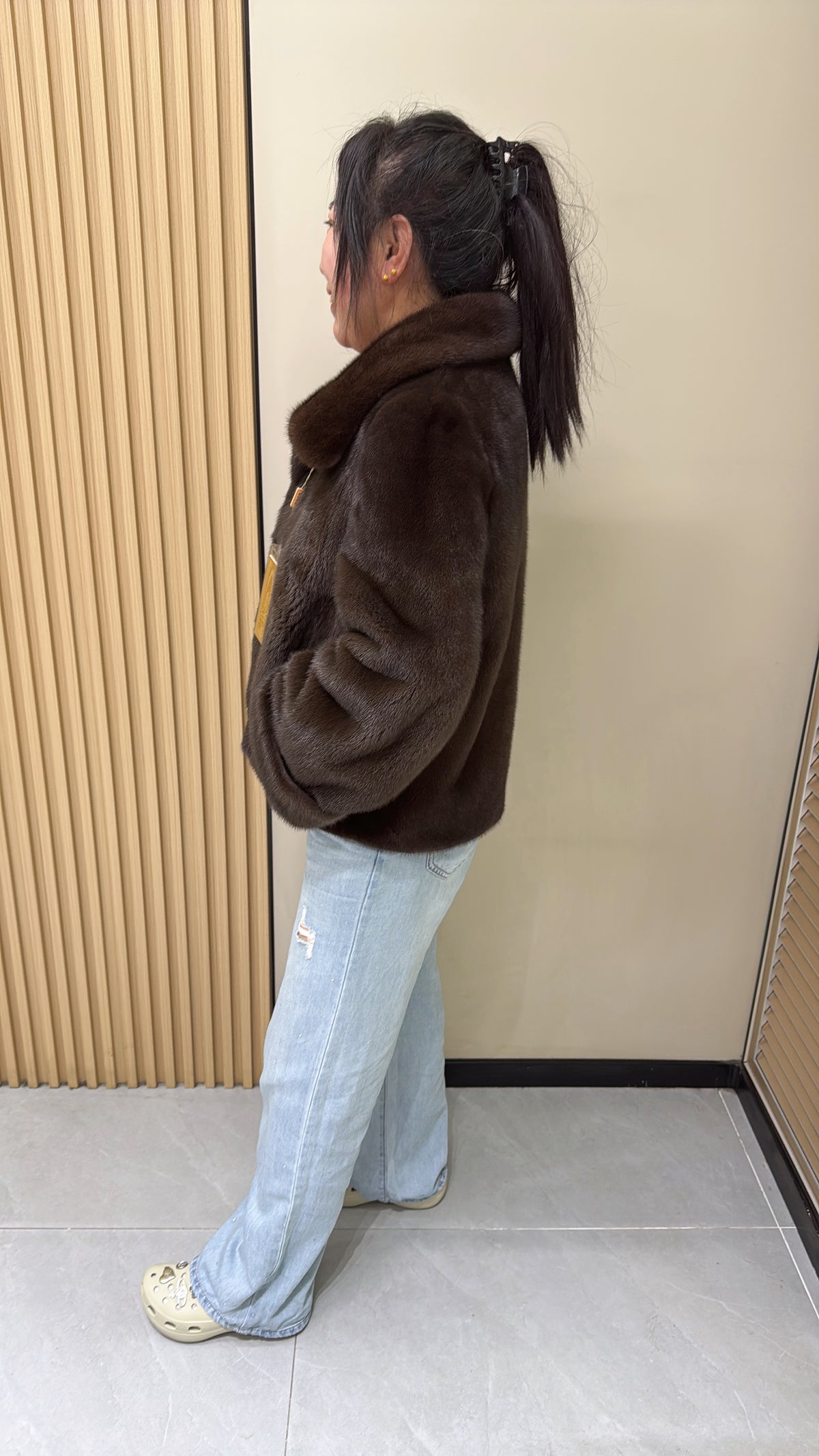 No. 002 Brown mink coat with a shawl collar and turn-up cuffs.