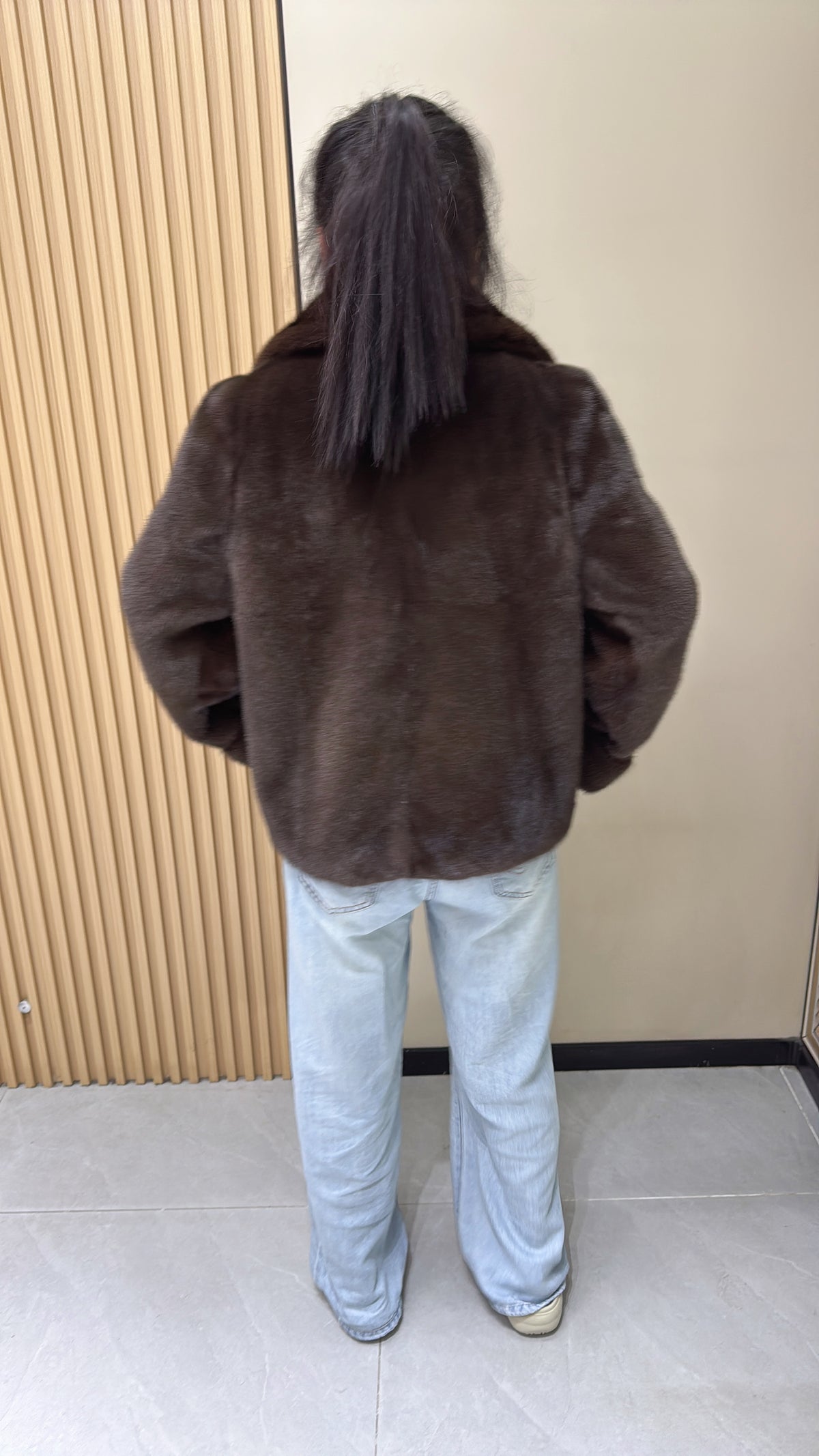 No. 002 Brown mink coat with a shawl collar and turn-up cuffs.