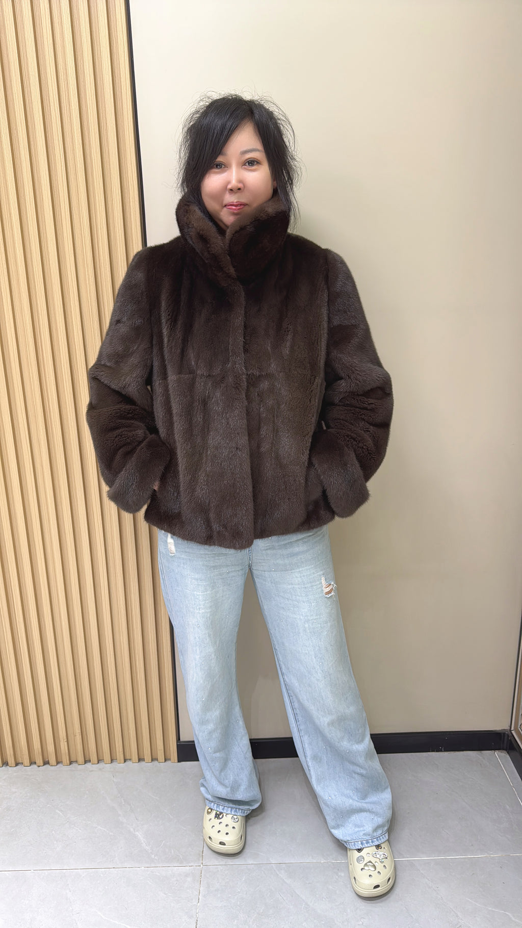 No. 002 Brown mink coat with a shawl collar and turn-up cuffs.