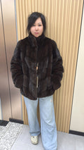 No. 006 Brown velvet-finish mink coat featuring a stand collar, diagonal buttoning, and roll-up sleeves.