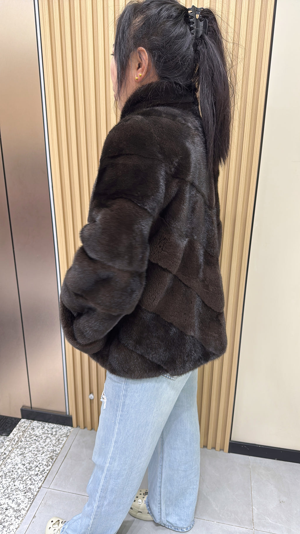 No. 006 Brown velvet-finish mink coat featuring a stand collar, diagonal buttoning, and roll-up sleeves.