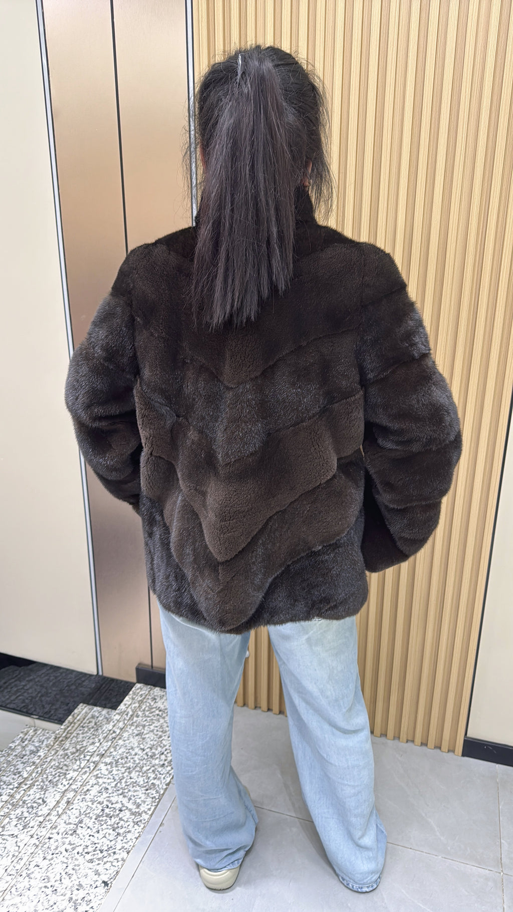 No. 006 Brown velvet-finish mink coat featuring a stand collar, diagonal buttoning, and roll-up sleeves.