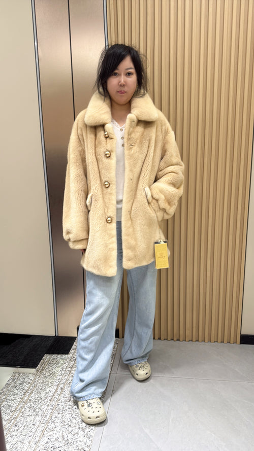 No. 009 Beige velvet-finish mink coat featuring a lapel collar, horizontal pocket flaps, and vintage-style button detailing.