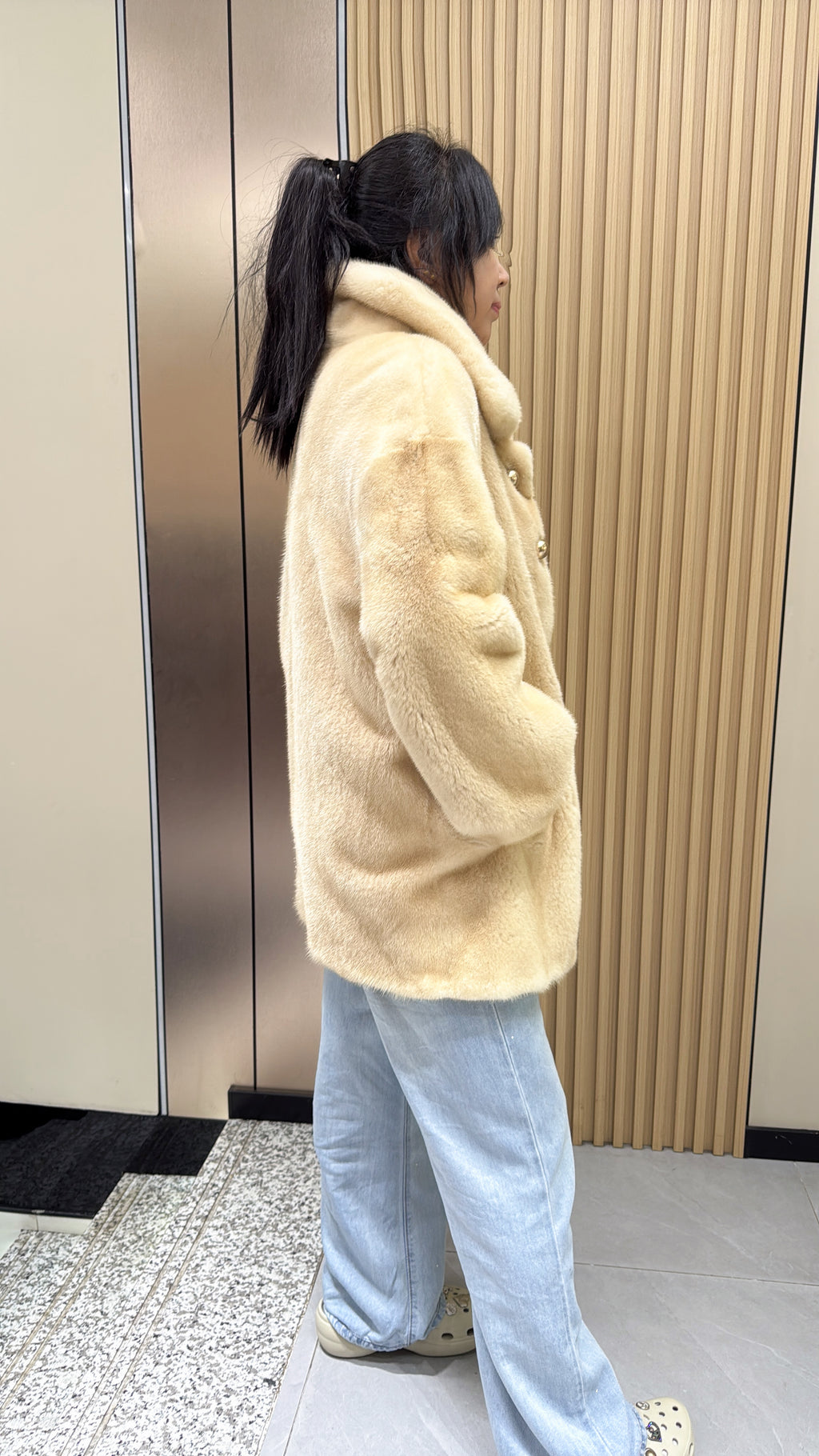 No. 009 Beige velvet-finish mink coat featuring a lapel collar, horizontal pocket flaps, and vintage-style button detailing.