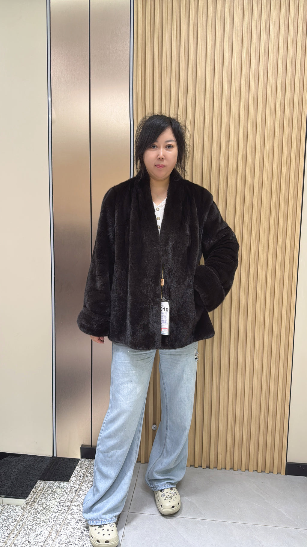 No. 010 Dark brown V-neck velvet-finish mink coat with roll-up sleeves.