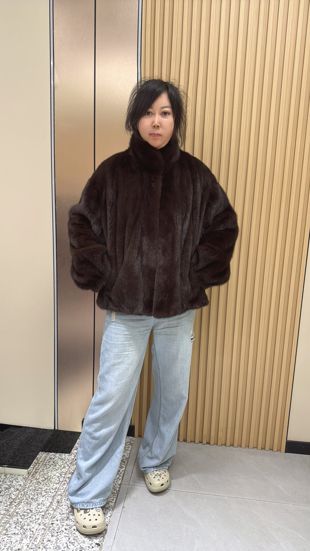 No. 012 Dark brown velvet-finish mink coat featuring a stand-up collar and fitted cuffs.