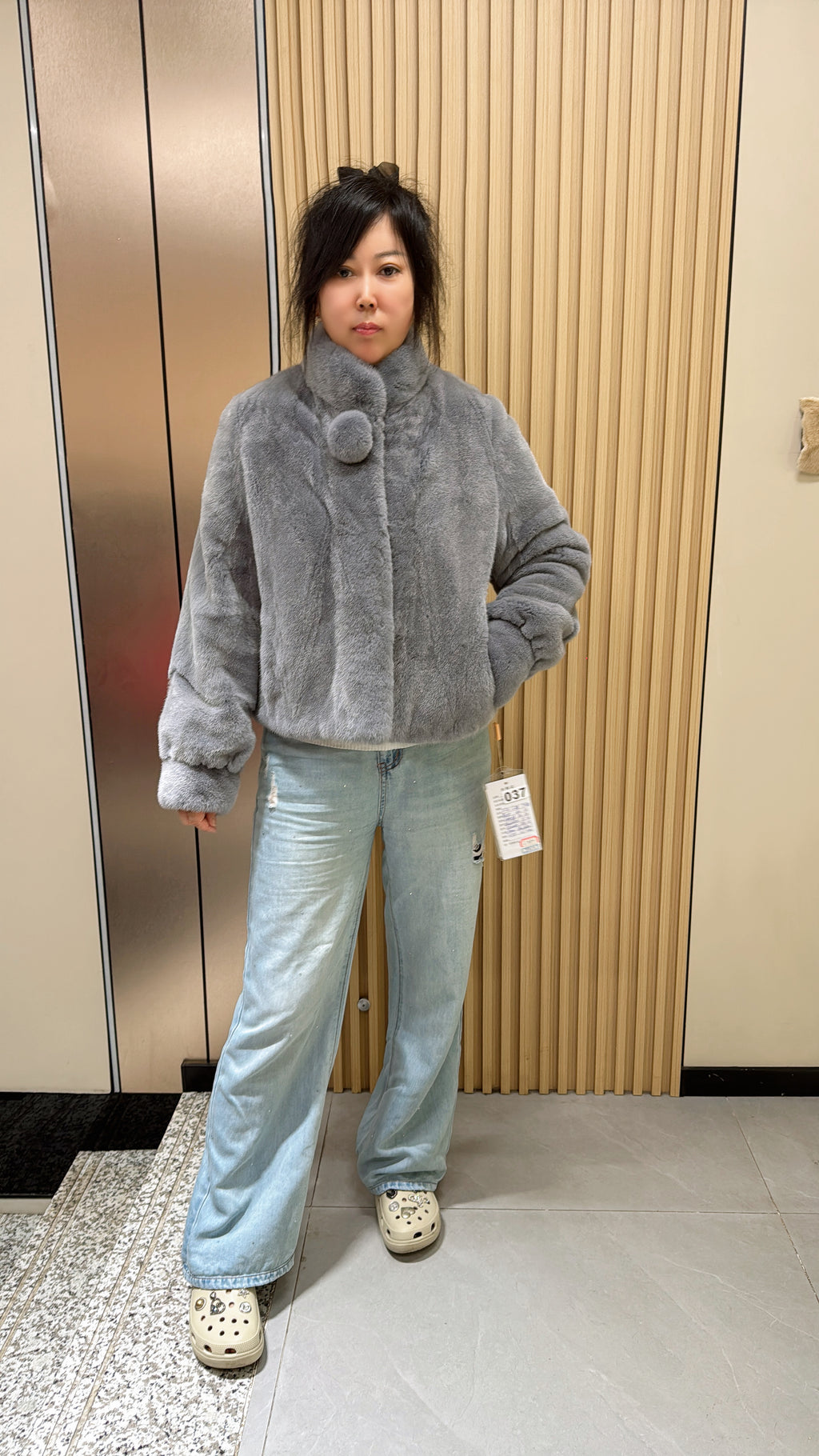 037 Grey mink fur coat featuring a stand-up collar and banded cuffs.