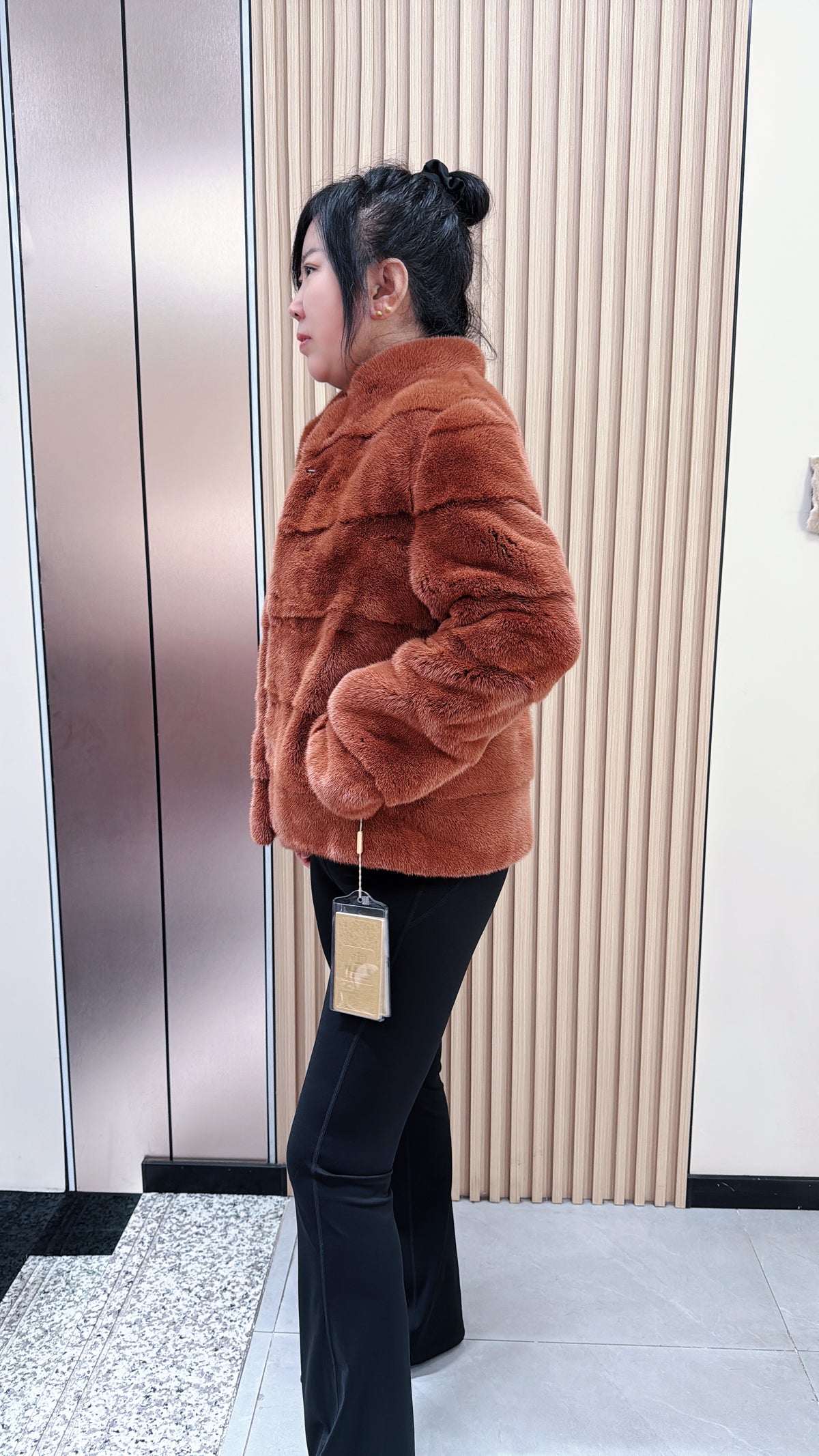 No. 044 Caramel-colored mink fur coat featuring a horizontal panel design.