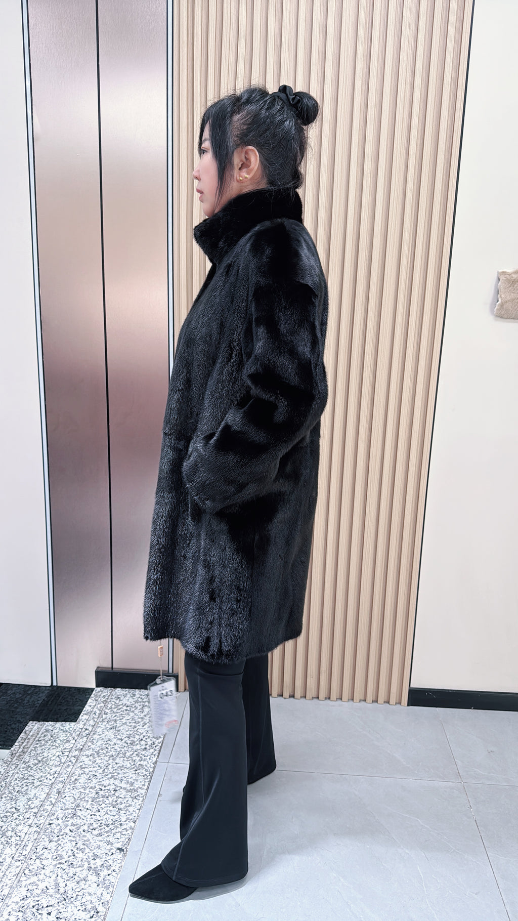 No. 043 Black reversible mink fur coat featuring a stand collar and zip closure.