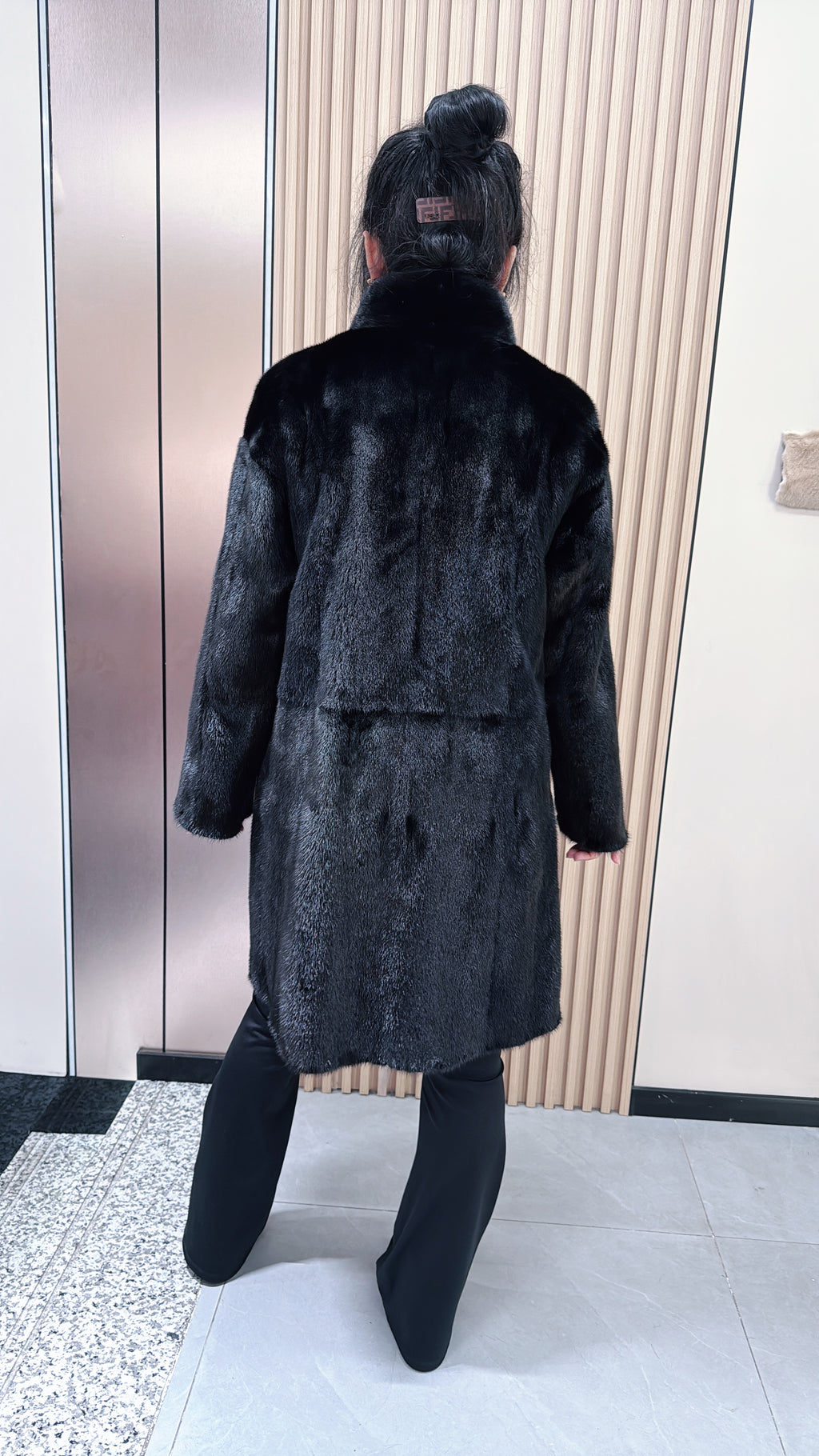 No. 043 Black reversible mink fur coat featuring a stand collar and zip closure.
