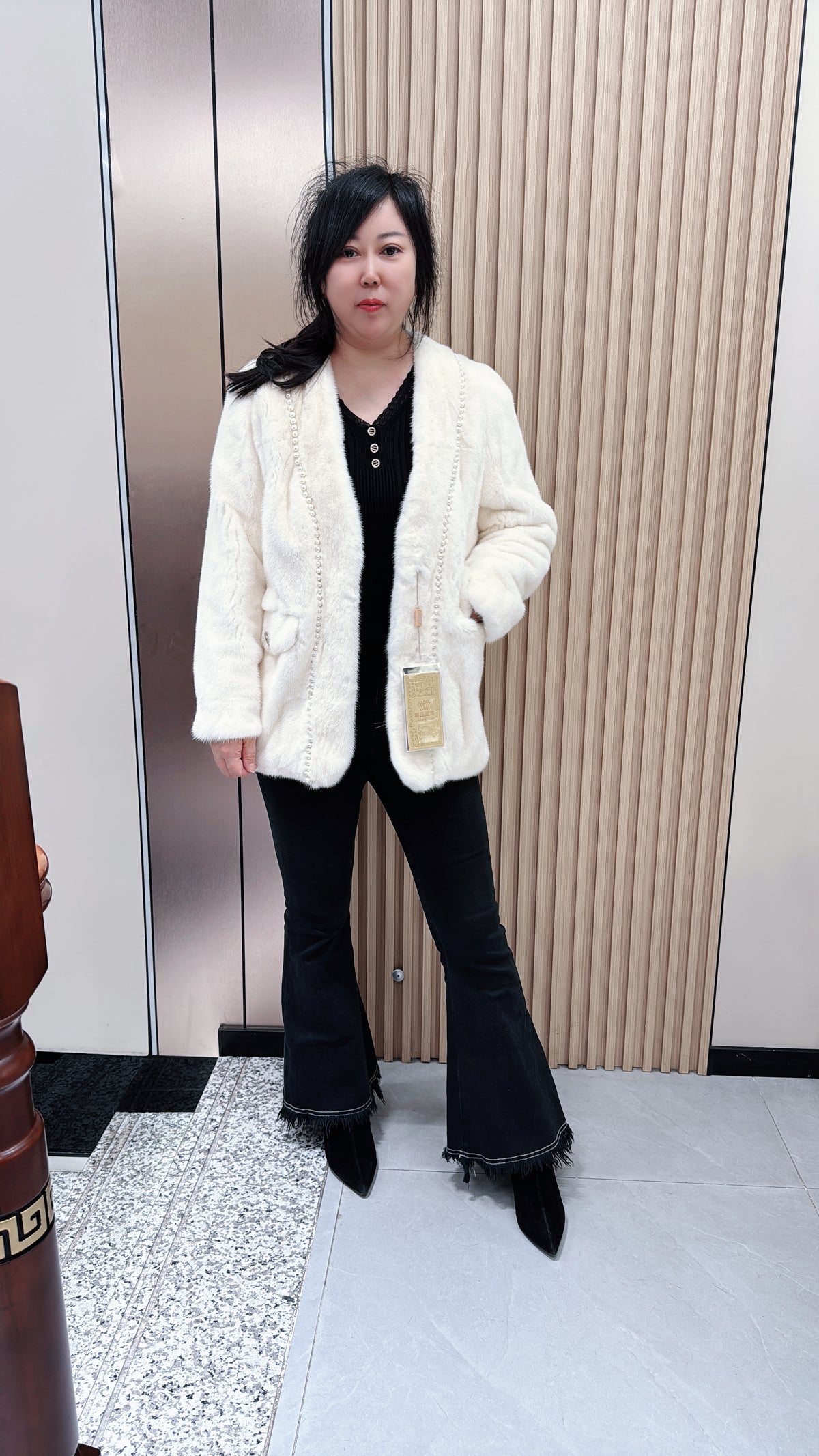 No. 079 White V-neck mink fur coat—Chanel style, accented with pearl details.