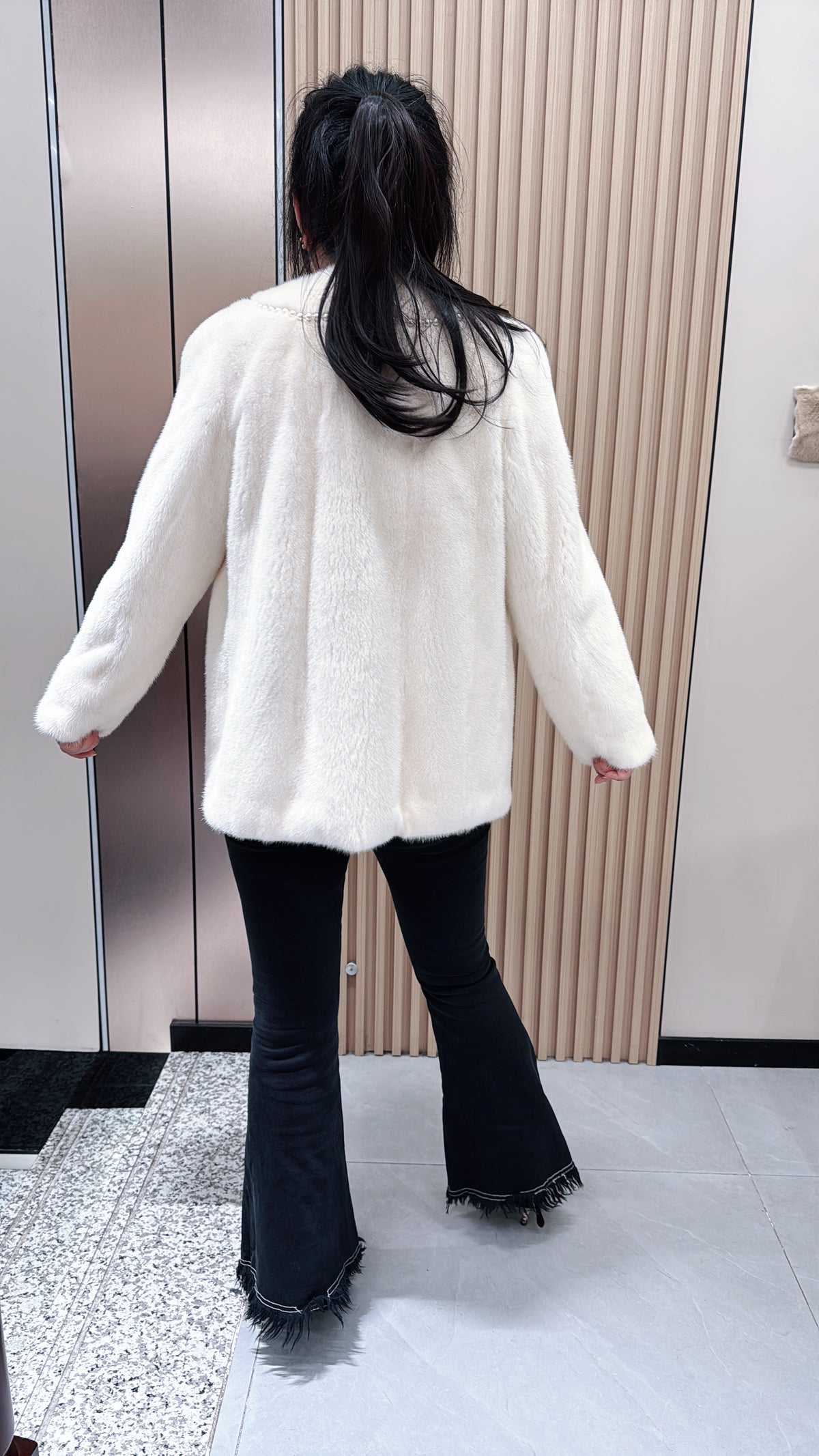 No. 079 White V-neck mink fur coat—Chanel style, accented with pearl details.