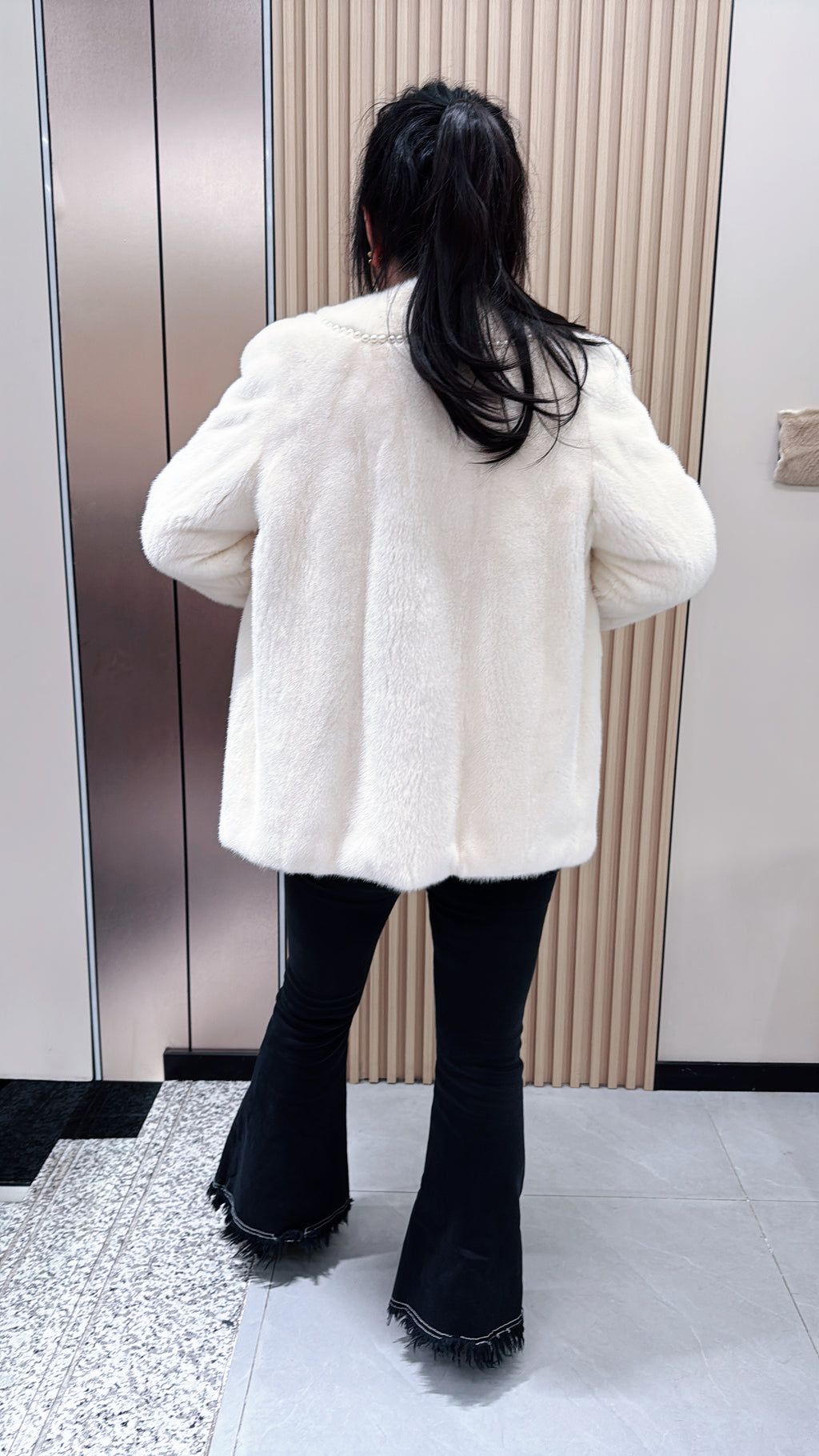 No. 079 White V-neck mink fur coat—Chanel style, accented with pearl details.