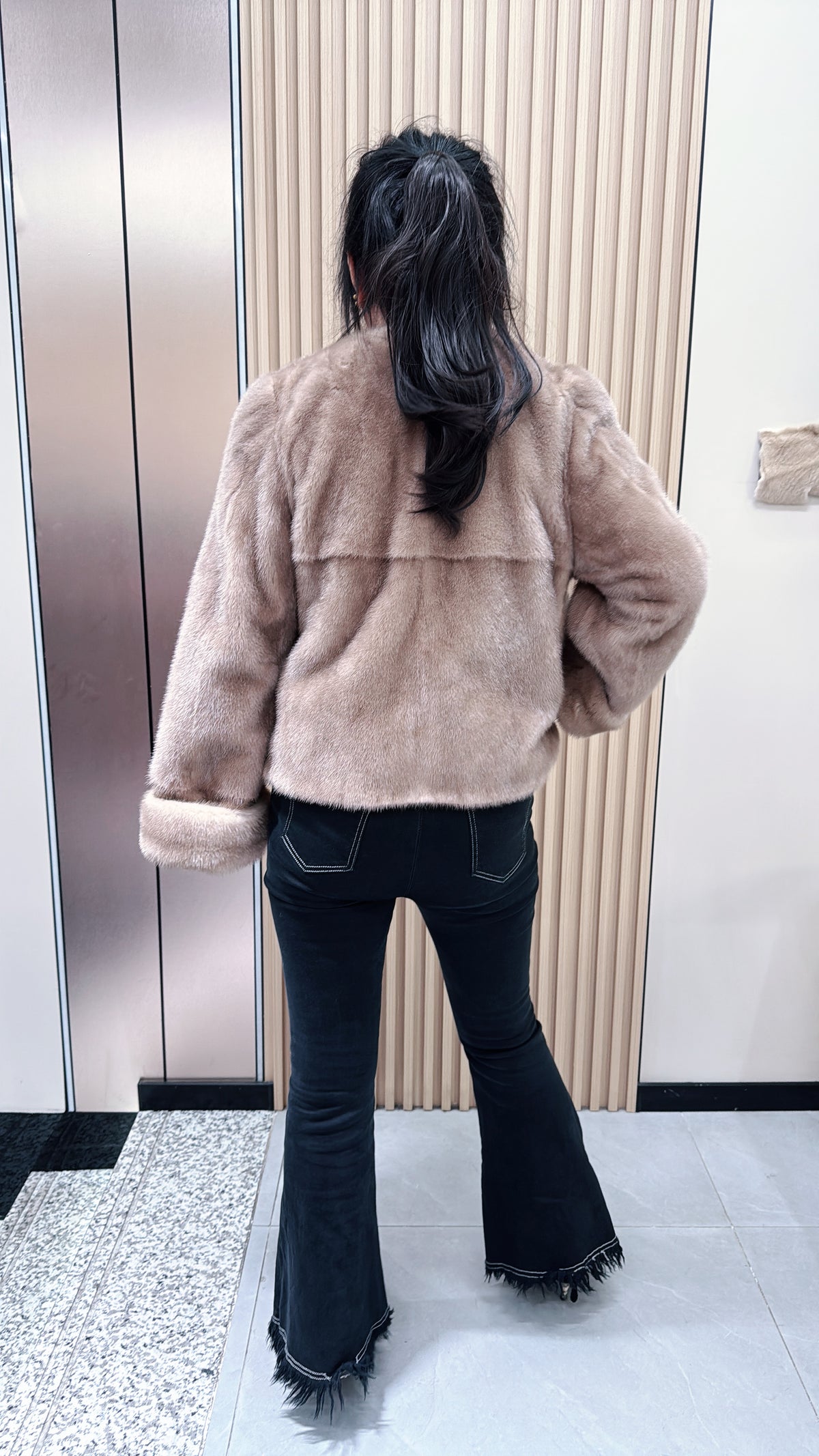 No. 090 Beige V-neck mink fur coat with turn-back cuffs.