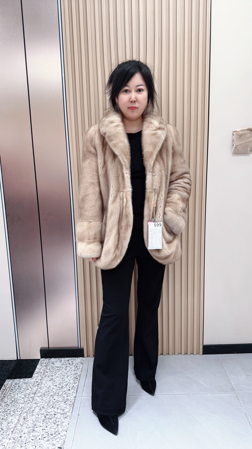 No. 099 Beige mink fur coat featuring a banana collar and a curved hem.
