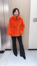 No. 095 Orange mink fur coat featuring a stand-up collar and banded cuffs.