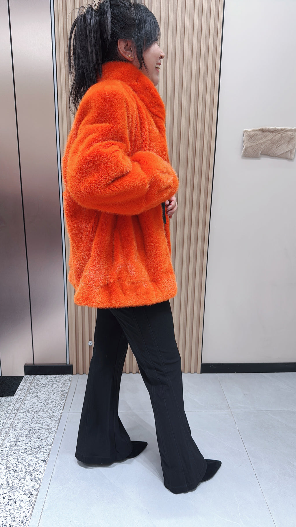 No. 095 Orange mink fur coat featuring a stand-up collar and banded cuffs.