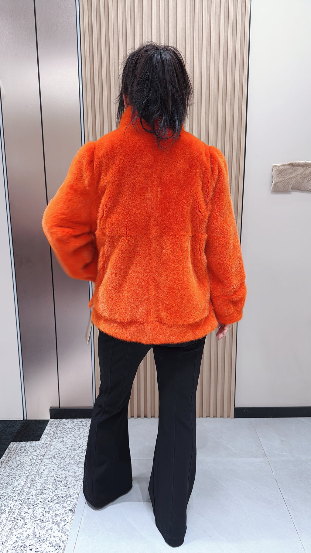 No. 095 Orange mink fur coat featuring a stand-up collar and banded cuffs.