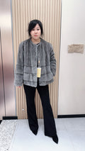 No. 140 Grey mink fur coat featuring a collarless design and a spliced "A/B" panel construction.