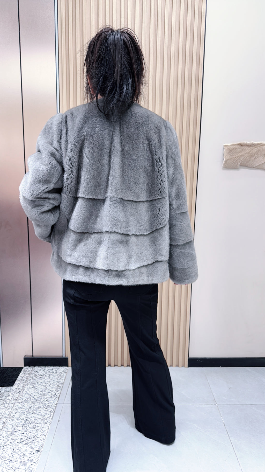 No. 140 Grey mink fur coat featuring a collarless design and a spliced "A/B" panel construction.