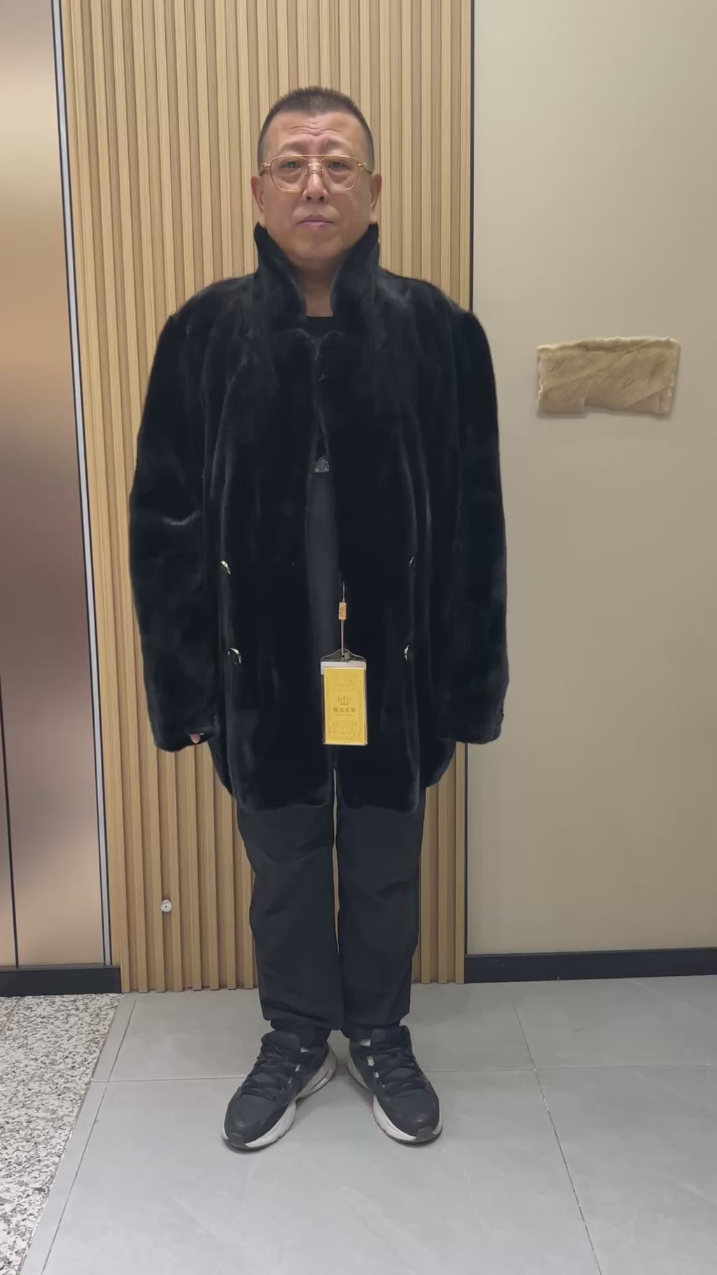 No. 124 Men's black mink coat featuring a button-front design and a suit-style lapel.