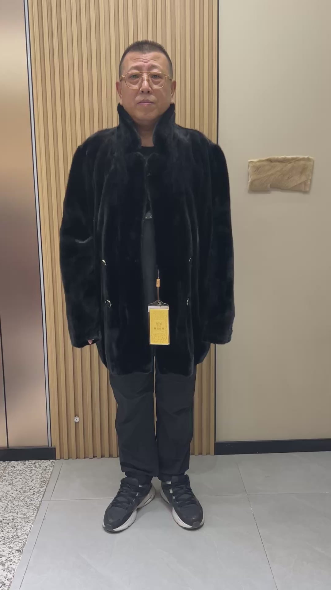 No. 124 Men's black mink coat featuring a button-front design and a suit-style lapel.