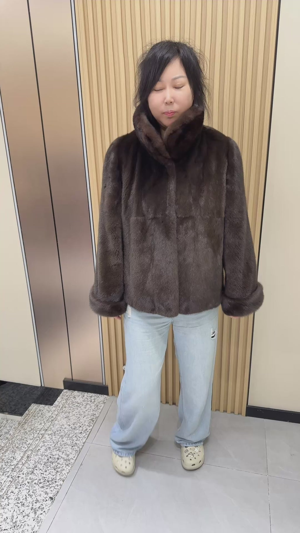 No. 002 Brown mink coat with a shawl collar and turn-up cuffs.