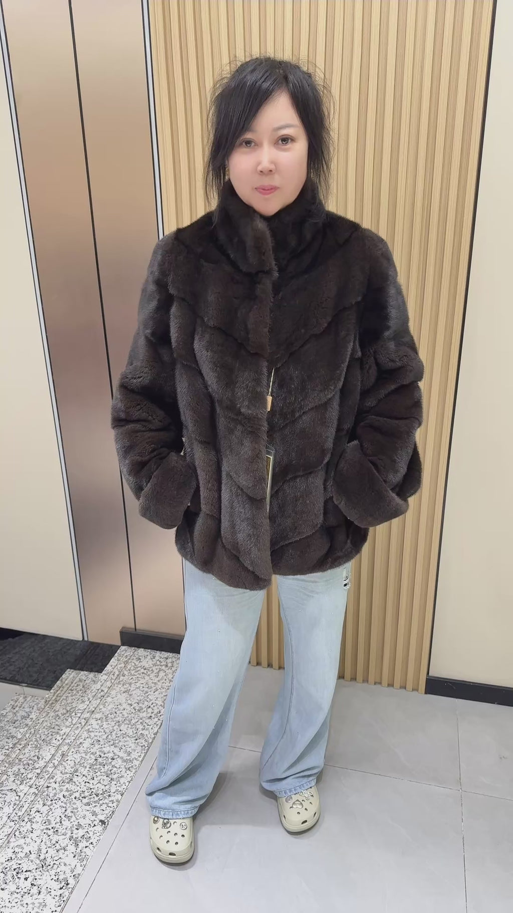 No. 006 Brown velvet-finish mink coat featuring a stand collar, diagonal buttoning, and roll-up sleeves.
