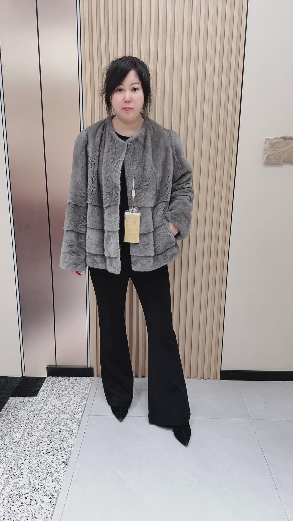 No. 140 Grey mink fur coat featuring a collarless design and a spliced "A/B" panel construction.