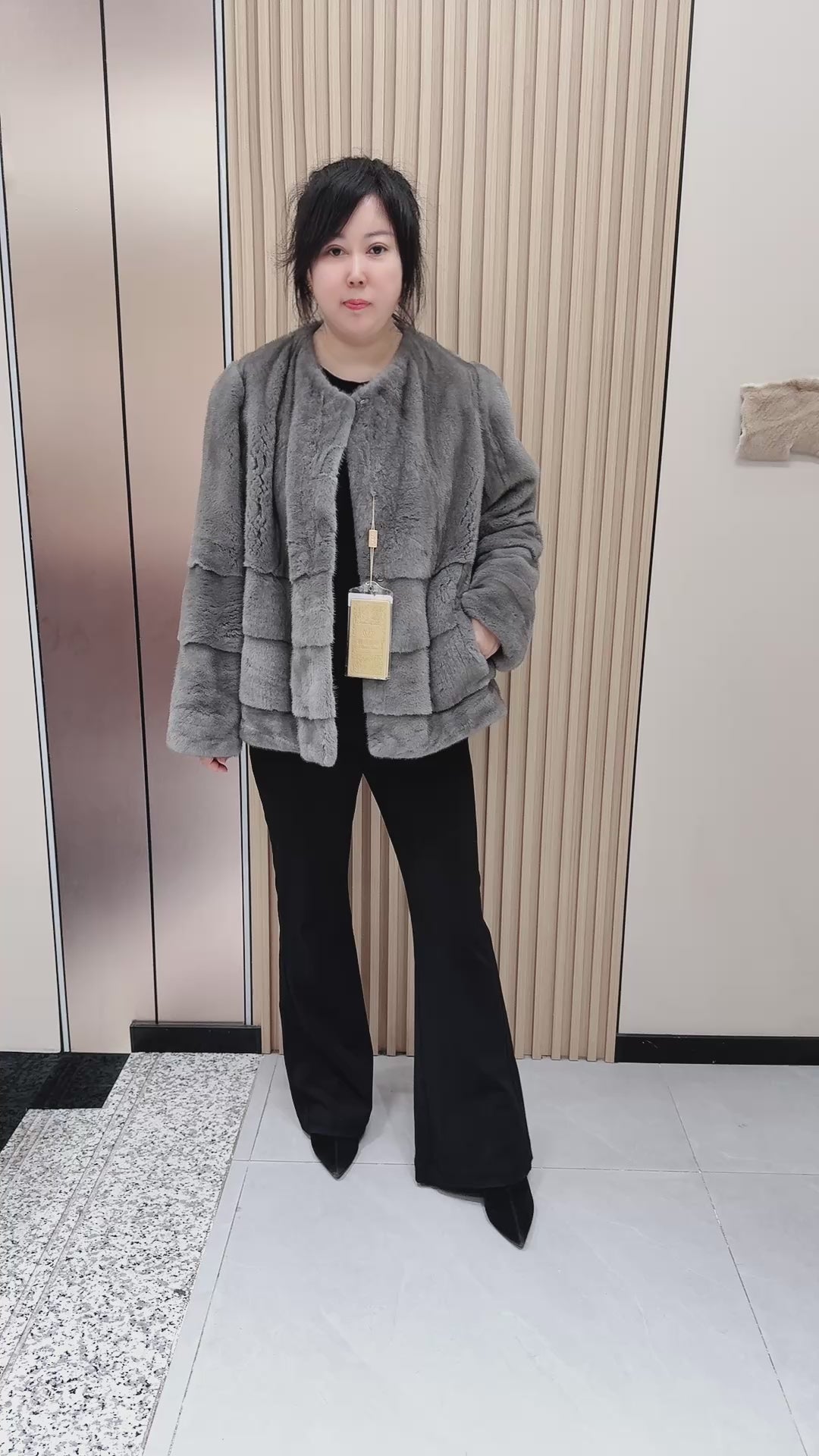 No. 140 Grey mink fur coat featuring a collarless design and a spliced "A/B" panel construction.