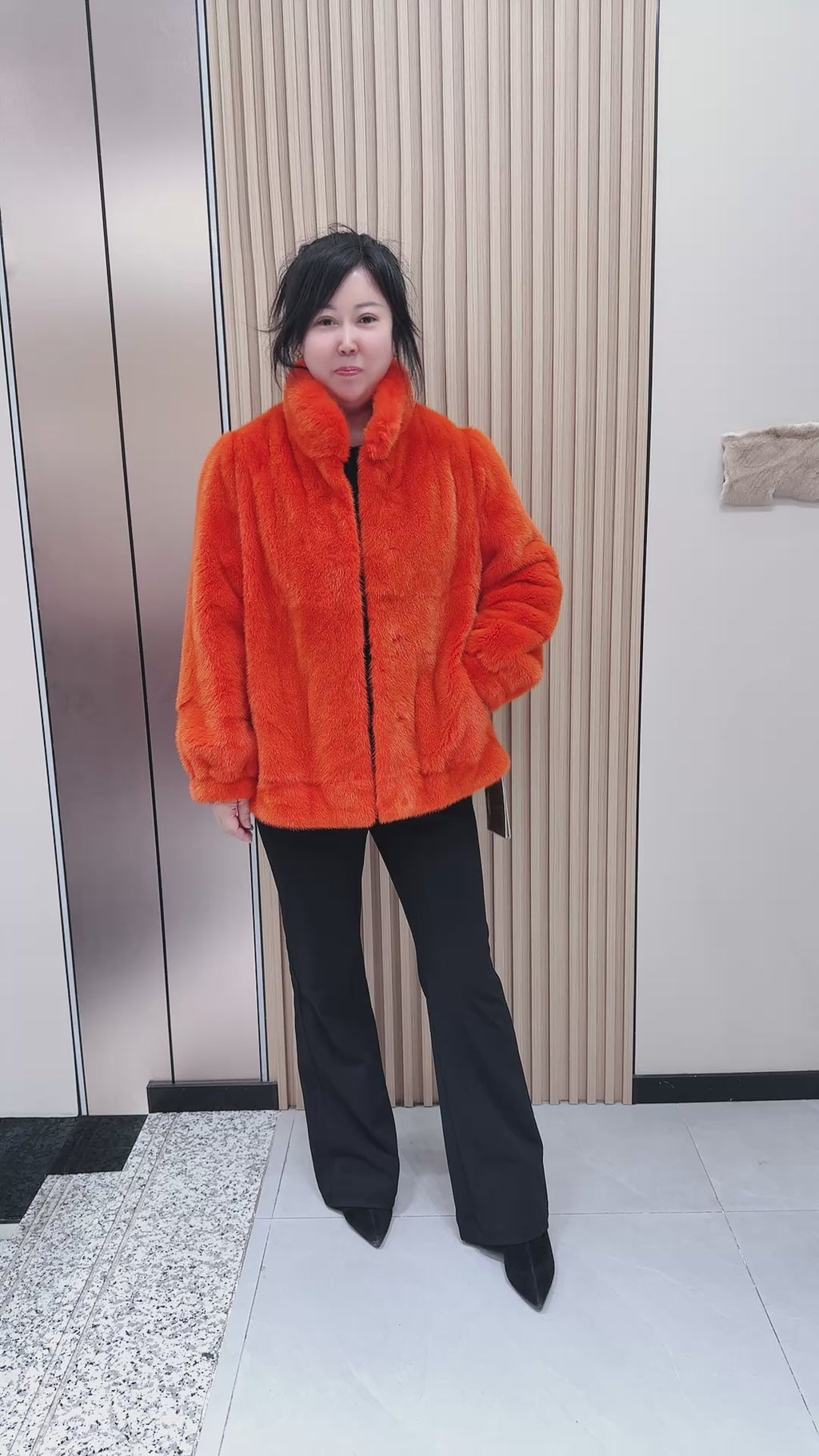 No. 095 Orange mink fur coat featuring a stand-up collar and banded cuffs.
