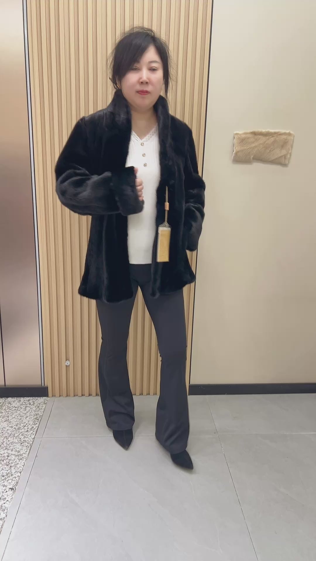 No. 220 black mink fur coat, featuring a stand collar and turn-up cuffs.