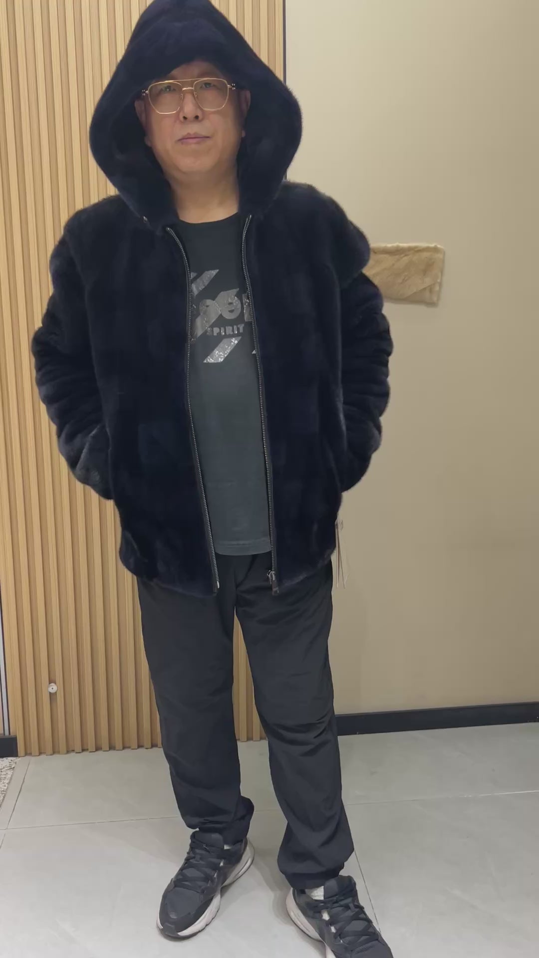 No. 129 Men's dark blue hooded mink coat with front zip closure.