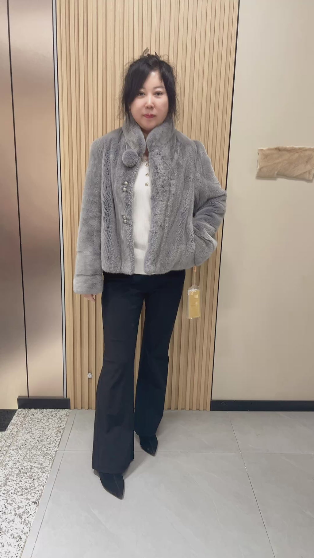 No. 162: Grey mink fur coat with a stand-up collar and pom-pom embellishments at the neckline.