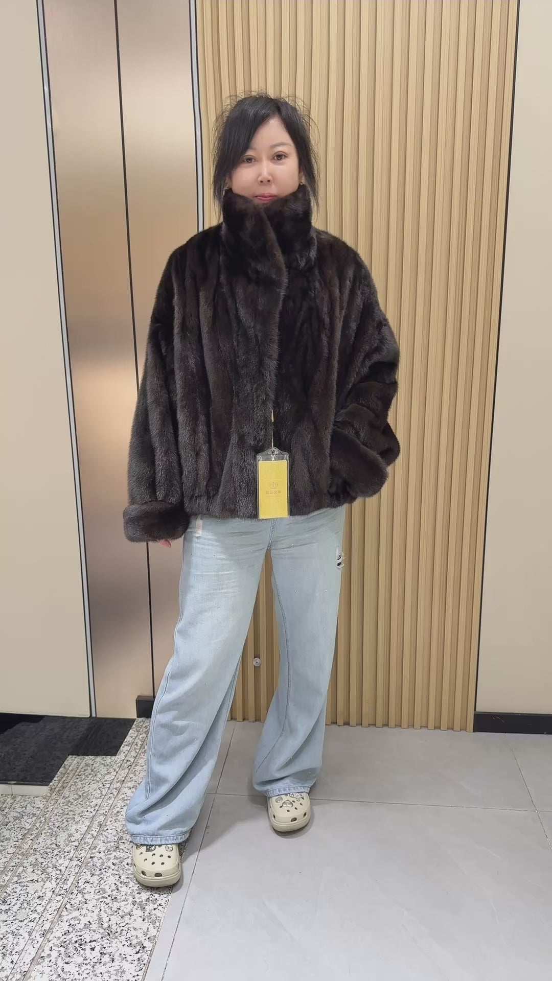 035 Brown mink fur coat featuring a lapel collar, batwing sleeves, and a turn-up cuff design.