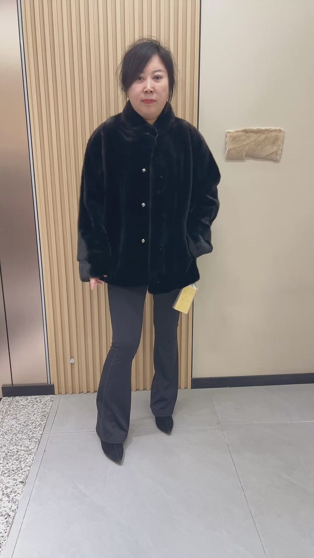 No. 225 black mink fur coat with a stand-up collar and vintage-style bronze-tone buttons.