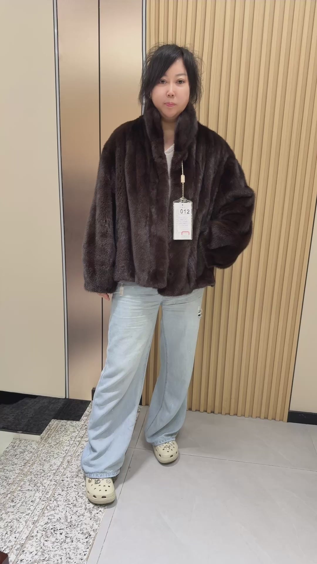 No. 012 Dark brown velvet-finish mink coat featuring a stand-up collar and fitted cuffs.